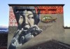 Изображение девушки, играющей на темир комузе, появилось на рок-площадке в Швейцарии